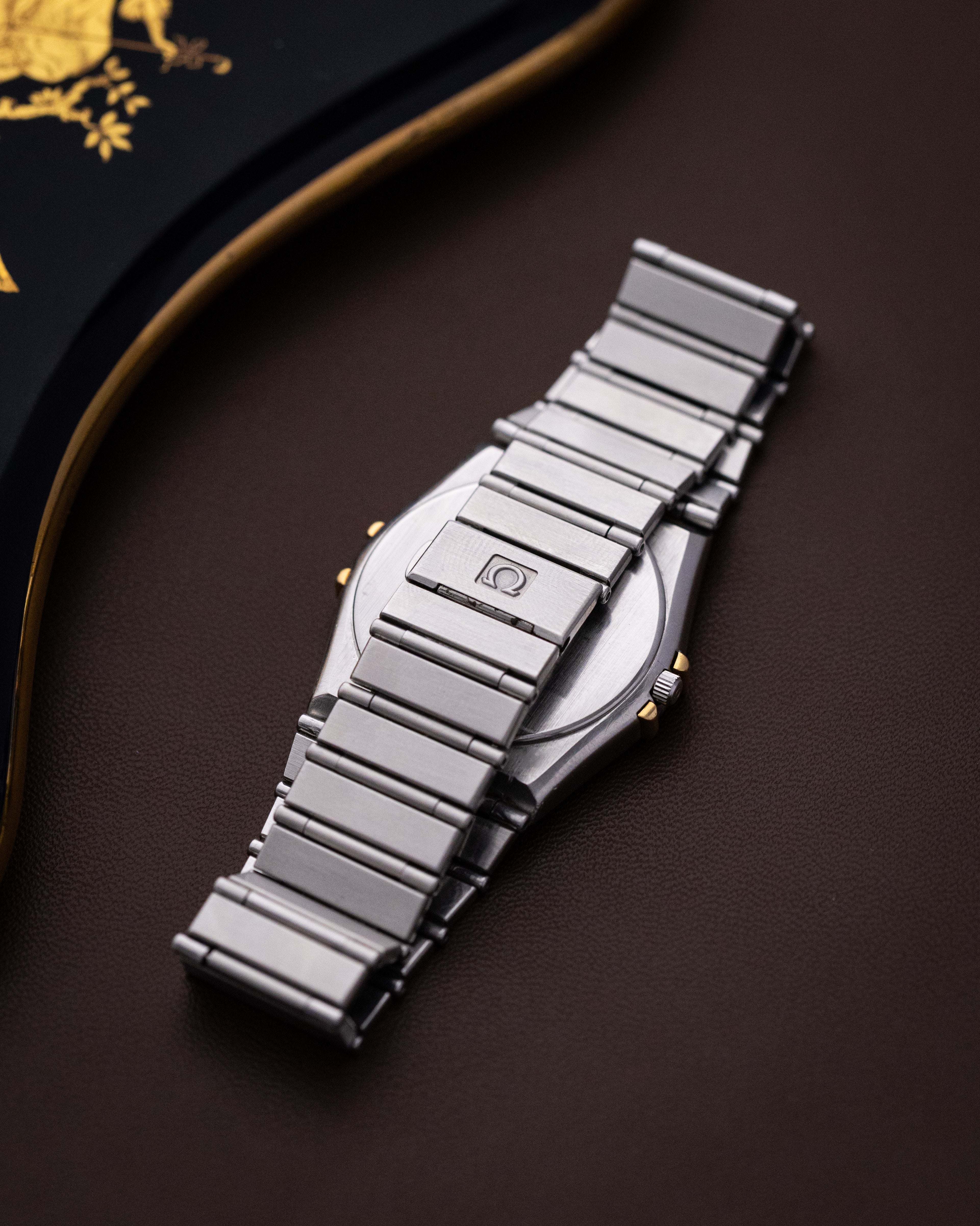 Vintage Omega Constellation Black Manhattan Day - Date, Solid Gold Bezel, Ref. DB 396.1070, Two - Tone Dial, Quartz Cal. 1444 from 1980s - DuMarko